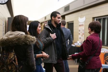 Students chat with Victoria Malone, assistant professor of language and coordinator of study abroad, during the Study Abroad Fair. - Photo by Kristi McMurry Woody
