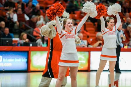 The cheerleaders pump up the crowd with Buster during the first round game of the Gulf South Conference Tournament against the University of West Georgia. - Photo by Kristi McMurry Woody