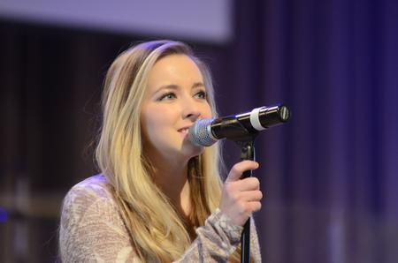 Emily Shoemaker, senior psychology major, sings at chapel. - Photo by Gretchen Foels