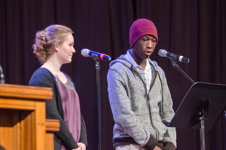 Amy Murdaugh, junior mathematics major, and Steven Cutliff-Talley, sophomore TESL major, read Scripture in the G.M. Savage Memorial Chapel. - Photo by David Parks