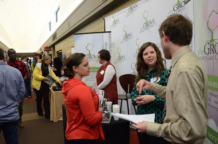 Members at The Grove Primary Care Clinic share with visitors during Social Work Awareness Day in the SUB. - Photo by MiKalla Cotton