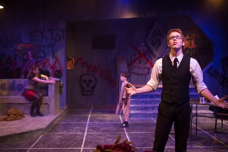 Sam Edgren, sophomore theatre major, delivers a dramatic line in The Queen and the Rebels. - Photo by Kristi McMurry Woody