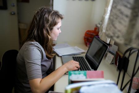 A student studies in her Heritage Complex room. - Photo by Kristi McMurry Woody