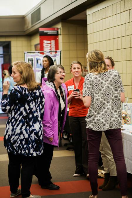 Mary Anne Poe, professor of social work, laughs with her colleagues and guests of Social Work Awareness Day. - Photo by Kristi McMurry Woody