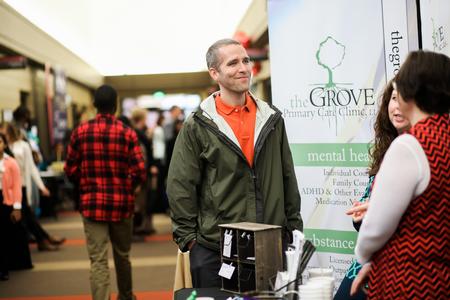 Jason Castles, assistant dean of students, browses the booths at Social Work Awareness Day. - Photo by Kristi McMurry Woody