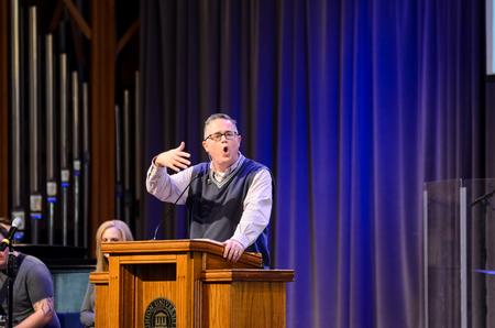 Todd Brady, vice president for university ministries, asks students to pray for spring Go trips. - Photo by Gretchen Foels