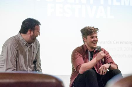 Cam Tracy, web development agent, interviews Josh Stephens, senior digital media studies major, during the 2016 Union Student Film Festival Awards & Screening. - Photo by David Parks