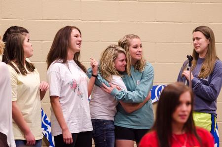 The ladies of Kappa Delta prepare to sing karaoke after being invited to the stage during Chi Omega's Pancakes & Karaoke Party in the Bowld Student Commons.  - Photo by David Parks