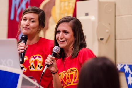 Sophomores Mary Byars, mathematics major, and Meredith Thomas, music education major, laughi as they keep up with their lyrics during the Pancakes & Karaoke Party benefiting Relay for Life. - Photo by David Parks