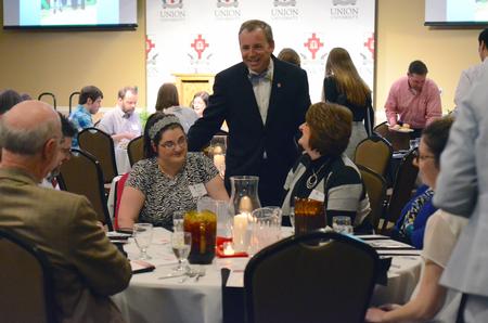 Dub Oliver, president of the university, talks to students and families before the EDGE Banquet begins in the Grant Events Center. - Photo by MiKalla Cotton