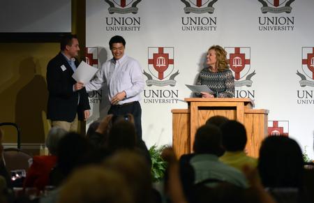 Kevin Ung, assistant director of Union EDGE, awards Ethan Wilson the "Bulldog award" during the EDGE Banquet in the Grant Events Center. - Photo by MiKalla Cotton