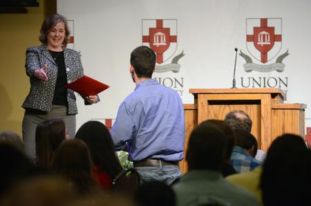 During the EDGE banquet, Jennifer Graves, director of the Union EDGE program, welcomes a new EDGE student who will start fall 2016. - Photo by MiKalla Cotton