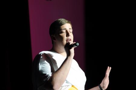 Brady Teague, senior spanish major, sings at Variety Show for Alpha Tau Omega.  - Photo by Gretchen Foels