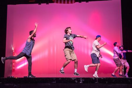 Fraternity brothers of small group Lambda Chi Alpha wow the crowd with speedy moves in their Variety Show performance.  - Photo by David Parks