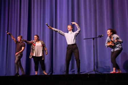 The 2016 Variety Show hosts, guests from the Blank Slate Improv team, close out the show by including the audience in their song. - Photo by David Parks