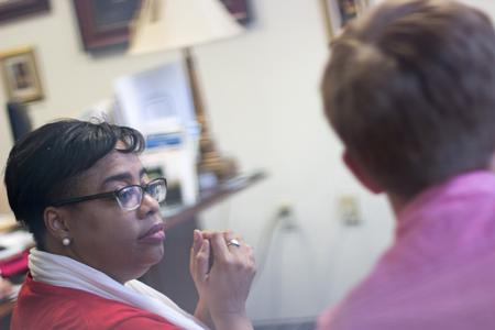 Jacqueline Taylor, assistant dean of students & director of the Vocatio Center, works closely alongside an English student on his resume during Walk-in Monday.  - Photo by David Parks