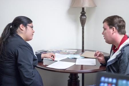 Alma Hernandez, graduate intern and peer success advocate, works with Brady Teague, senior Spanish major, during the Vocatio Center's Walk-in Monday.  - Photo by David Parks