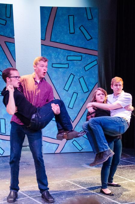Members of the Blank Slate Improv team portray wolves at a restaurant at the "Dub Show." - Photo by Gretchen Foels