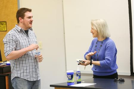 Zack Jackson, 2010 engineering graduate, chats with Jeannette Russ, professor of engineering and department chair, before a presentation. - Photo by Kristi McMurry Woody