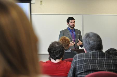 Jameson Winter, senior christian ministry and missions major, discussed his paper on the integration of mathematics with theology during the Scholarship Symposium.  - Photo by Elizabeth Wilson