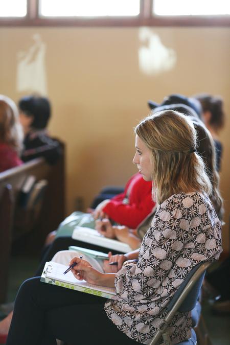 Students take notes during the Immigration: Church & Community Mobilization workshop hosted by the language, sociology and social work departments. - Photo by Kristi McMurry Woody