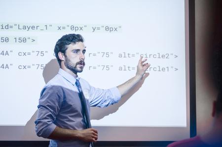 Chris Hare, senior digital media studies major, discusses HTML code during his Scholarship Symposium presentation on SVGs and CSS3 animations.  - Photo by David Parks