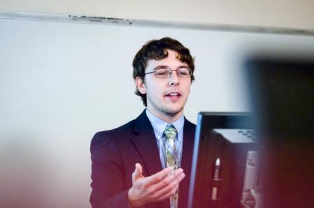 Ryan Shaw, senior computer science major, introduces a web application he designed for Jackson Energy Authority in his Scholarship Symposium presentation.  - Photo by David Parks