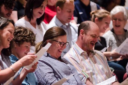 Members of the audience enjoy singing along with the jazz band's last piece. - Photo by David Parks