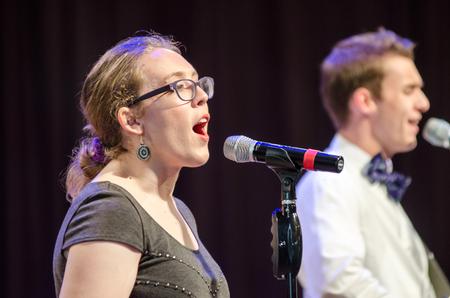 Melissa Locke, senior theater major, and Jonathan Greer sophomore philosophy major, lead worship at chapel. - Photo by Gretchen Foels