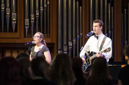 Melissa Locke, senior theater major, and Jonathan Greer sophomore philosophy major, lead worship at chapel. - Photo by Gretchen Foels