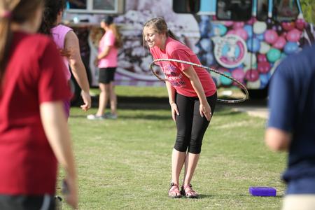 Caroline Davis, freshman social work major, participates in the hula-hoop toss during Res Life Field Day. - Photo by Kristi McMurry Woody