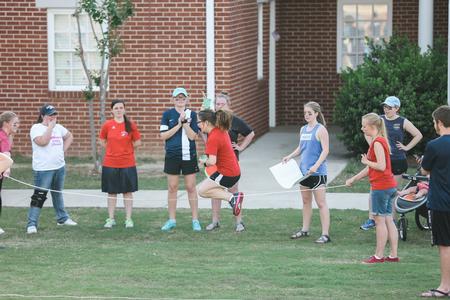 Students cheer for their teammates competing in the water relay portion of Res Life Field Day. - Photo by Kristi McMurry Woody