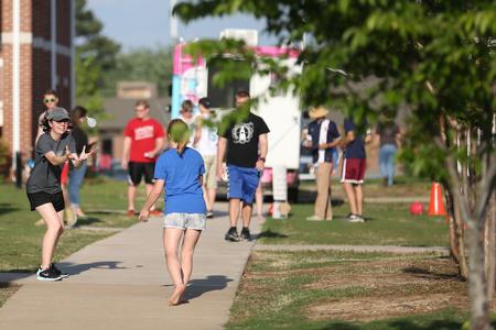 Susanna Mann and Chelsey Sauls, sophomore conservation biology majors, compete in the balloon toss during Res Life Field Day.
 - Photo by Kristi McMurry Woody