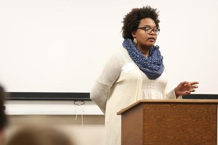 Ashley Akerson, senior art major, answers questions following her Scholarship Symposium presentation. - Photo by Kristi McMurry Woody