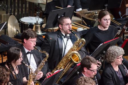 Saxophone players perform finely alongside other wind instruments in the Symphonic Band concert. - Photo by David Parks