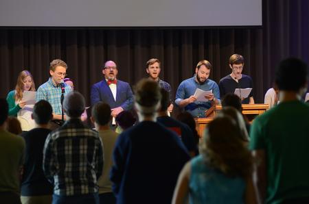 Ryan Sinni, sophomore English major, reads to the congregation during chapel lead by the honors community in the G.M. Savage Memorial Chapel. - Photo by MiKalla Cotton