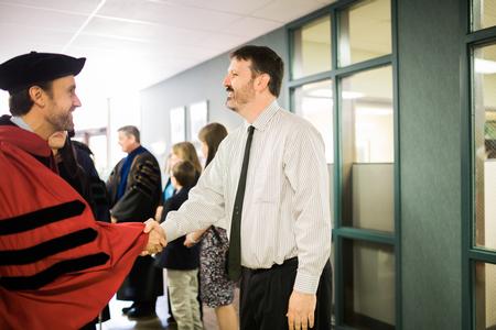 Cam Tracy, web development agent and 2015-2016 Staff Member of the Year, is congratulated by his peers after Awards Day Chapel. - Photo by Kristi McMurry Woody