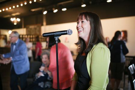 Joy Moore, director of Barefoots Joe, welcomes guests to a celebration of the 20th anniversary of the naming of the Barefoot Student Union Building. - Photo by Kristi McMurry Woody