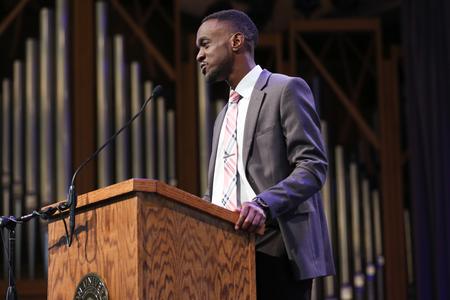 Jeremiah Murila, engineering graduate, speaks to his classmates during the Graduate Commissioning Service.  - Photo by Kristi McMurry Woody