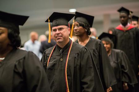 Michael Sellers, BSOL graduate, processes with his classmates into Summer Commencement at West Jackson Baptist Church. - Photo by Kristi McMurry Woody