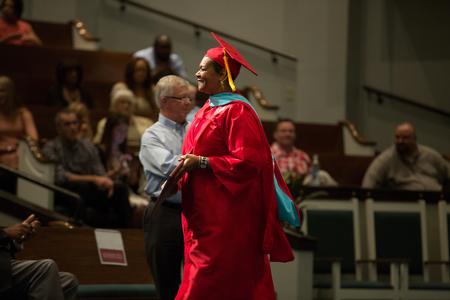 Sheryl Coleman, doctor of education graduate, poses for a photo after receiving her diploma at Summer Commencement. - Photo by Kristi McMurry Woody
