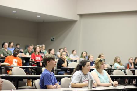 Students listen intently at the Student Leadership Program orientation in Harvey Auditorium. - Photo by Morgan Morfe