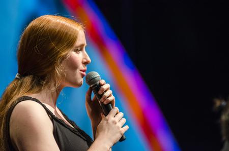 Kelsey Edgrin, alumnae, sings with Psallos during the 19th annual Scholarship Banquet. - Photo by Gretchen Foels