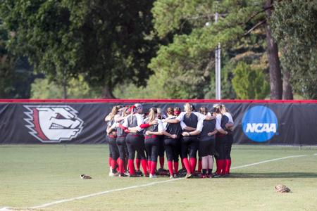 Union University's softball team prays before a Saturday game.  - Photo by Morgan Morfe