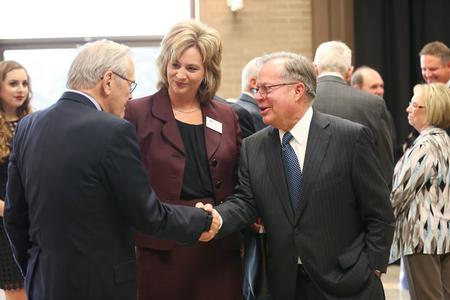 Former U.S. Secretary of Defense Donald Rumsfeld greets Carl Kirkland during a reception prior to the 19th annual Scholarship Banquet. - Photo by Kristi McMurry Woody