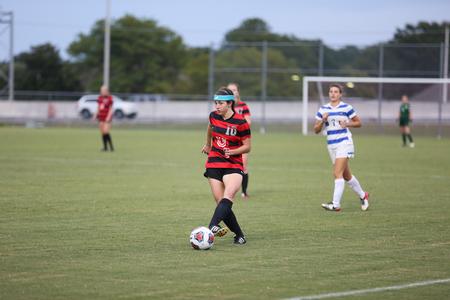 Freshman Alli Herring takes the ball downfield during a game against Shorter University. - Photo by Kristi McMurry Woody
