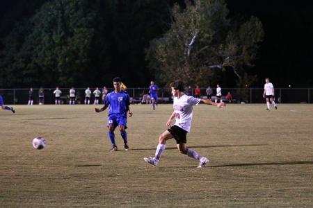 Freshman Cole Asfour plays against Shorter University. - Photo by Kristi McMurry Woody