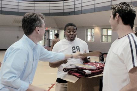 Director of Enrollment Services Robbie Graves distributes promotional materials to former student Ray Jones. Jones’ Living Proof/Primary Focus team will represent Union and two other universities as they travel. - Photo by Amanda Herron