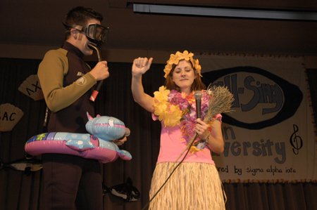 All-Sing hosts Brennan Uthe and Lindsay Abell go all out to entertain the Family Weekend crowd. - Photo by Kathleen Murray