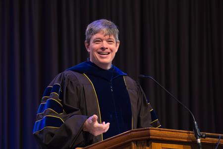Wed Drake, associate professor of communication arts and department chair, delivers his chapel address as the faculty member of the year.  - Photo by Janelle Vest